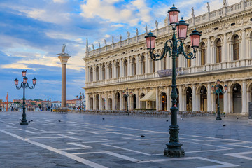 Obraz premium The picturesque Piazza St Marco or Saint Mark's square at sunrise in Venice Italy