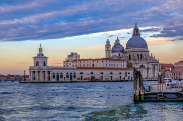 Fototapeta na wymiar Grand Canal at St Marco square with Basilica of Santa Maria della Salute at sunrise in Venice Italy