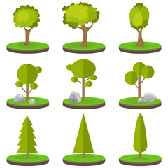 Trees on a piece of land. A set of trees with stones on green grass.