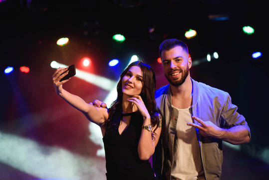 Couple Take A Selfie With A Mobile In The Night Celebration