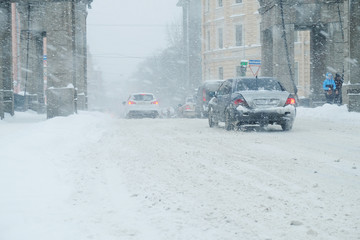 snowfall on the roads of the modern big city