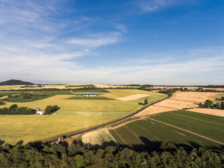 Aerial view of agricultural fields in spring with blue sky in germany