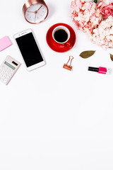 Feminine desk workspace frame with pink beige floral bouquet, red coffee cup, smartphone on white background with copy space. Flat lay. Top view. Valentines day background.