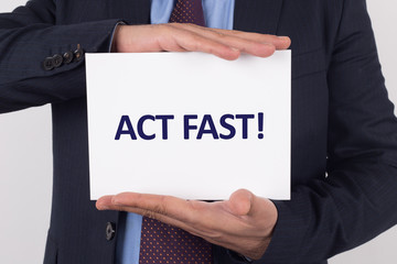 Man showing paper with ACT FAST! text