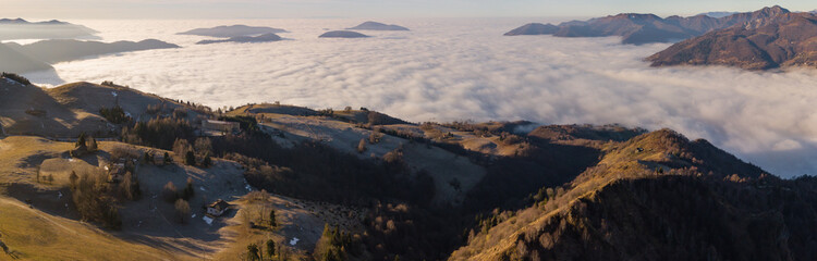 Drone aerial view to the Po plain and Seriana valley. The fog covers all the villages and the Padana plain