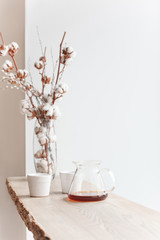 Cup of coffee, branch of tree, wooden windowsill