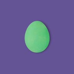 green easter egg on ultraviolet background, color of 2018