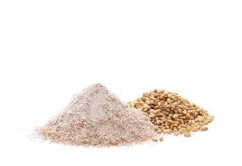 Integral wholewheat flour pile and wheat grains isolated on white background