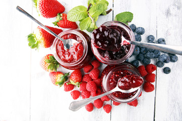 assortment of jams, seasonal berries, mint and fruits