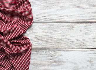 Checkered napkin on a wooden background