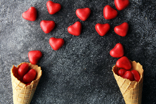 Valentine day candy with red hearts and cones