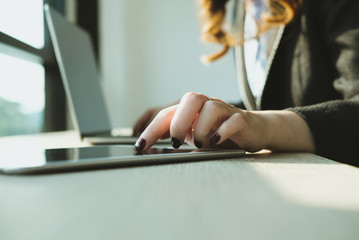 businesswoman using tablet computer at workplace. startup woman working with computer at office.  young female entrepreneur analyze accounting market data.