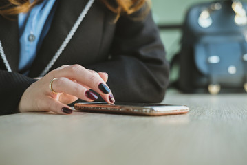 businesswoman using app in smartphone at office. woman texting message at workplace. social network communication, wireless connection, lifestyle concept