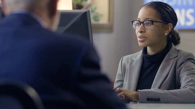 Black female banker meeting with client for a business loan