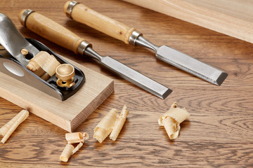 Obraz na płótnie Canvas DIY concept. Woodworking and crafts tools. Carpentry hand tools. Planers, chisels, measuring tools. Wooden background.