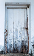 White wood texture background of distressed pine wood with knots, Old wooden house door