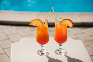 Cocktails on the background of the pool