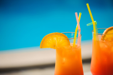 Cocktails on the background of the pool