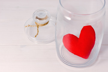 felt heart closed in glass jar