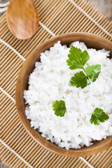 Boiled rice in a wooden bowl