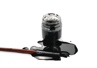 Obraz premium Spilled black watercolor with bottle and paintbrush isolated on white background