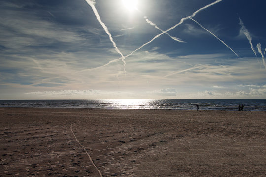 Plane trails above Baltic sea.
