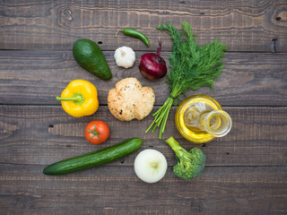 Fresh vegetables, decanter with sunflower oil and bread on the table