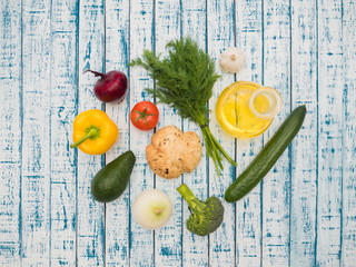 Fresh vegetables, decanter with sunflower oil and bread on the table