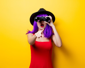 hipster girl with purple hairstyle and binoculars