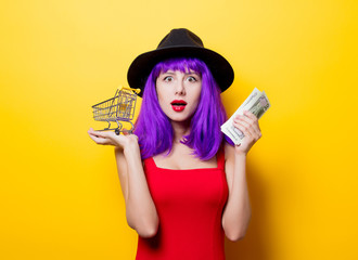 girl with money and shopping cart
