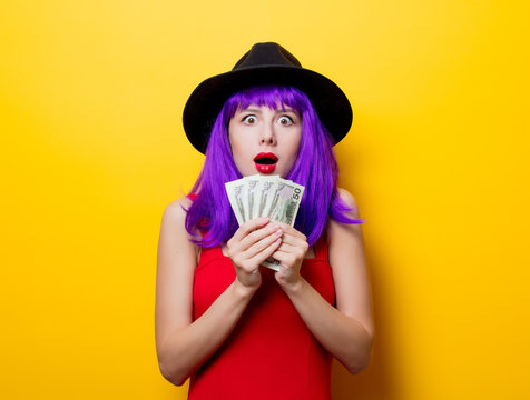 hipster girl with purple hairstyle with money