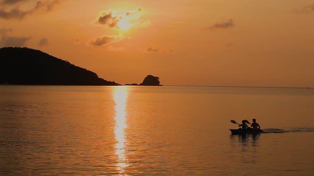 kayaking on sunset ocean