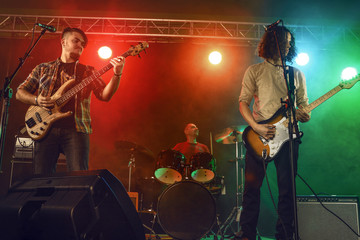 Obraz premium Rock band performs on stage.