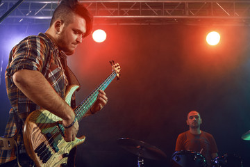 Obraz premium Bass player perform on stage.