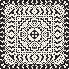 Seamless ethnic and tribal pattern. Hand drawn ornamental stripes. Black and white print. Vector geometric background.