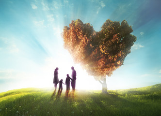 Happy family with Heart shaped tree