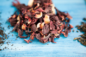 Close up of tea leaves on vintage blue background