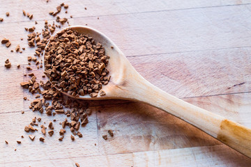 Instant Granulated Coffee Powder on Wooden Spoon.