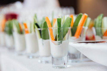 individual vegetarian Cocktail shots with yogurt savory sauce