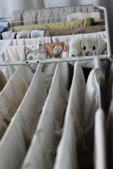 Laundry rack full of clothes and napkins for a newborn baby