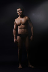 Fototapeta na wymiar Portrait of an athletic Asian Man, black and white photo