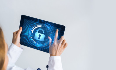 Close of female doctor hands working with tablet pc computer