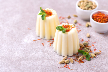 Indian kulfi dessert, ice cream with safron, mint, nuts