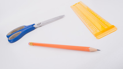 Pencil and centimeter on white background