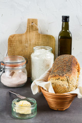 Handmade spelled bread. White background. Salt, flour and butter.