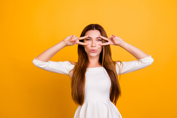 Portrait of beautiful attractive pretty charming cheerful joyful trendy stylish flirty stunning elegant woman with long straight hair demonstrating double v-sign isolated on background