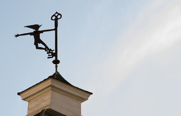 weather vane on the roof of the old tower - obrazy, fototapety, plakaty