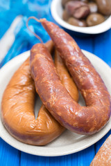 smoked portuguese sausages on white plate