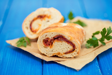 bread with smoked sausage on plate