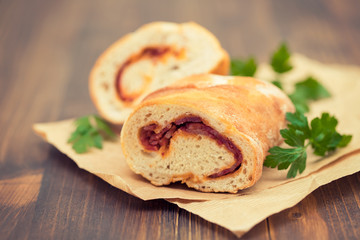 bread with smoked sausage on plate